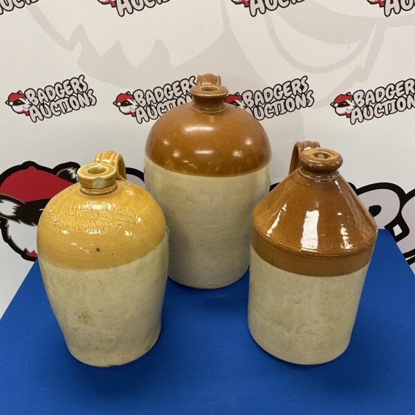 Antique salt glazed flagons including Patrick Ryan Kilkenny pottery.