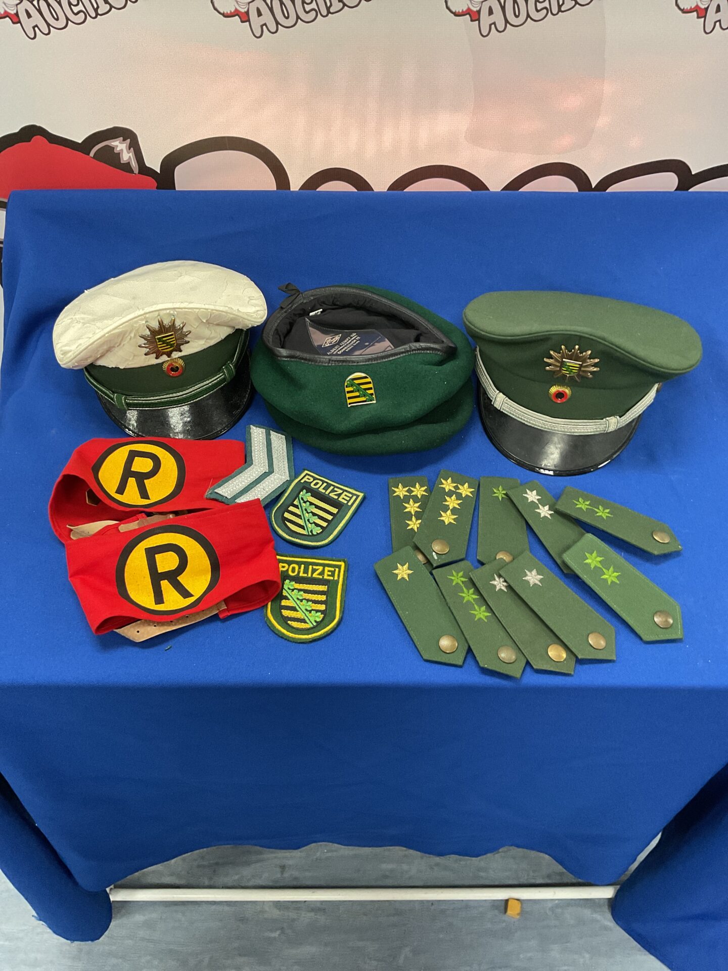 919 Collection of German Westfalia police Hats Berets and badges
