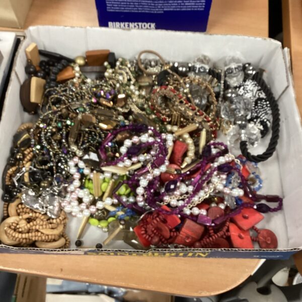 Colourful costume jewellery lot with beaded necklaces and fashion accessories.