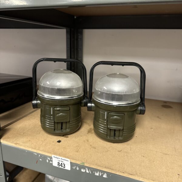 Pair of vintage enamel camping lanterns for outdoor use.