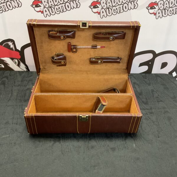 Vintage wine tasting kit in a brown leather case.