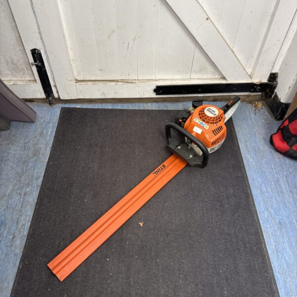 Stihl HS45 hedge cutter on a doormat, showing the full unit.