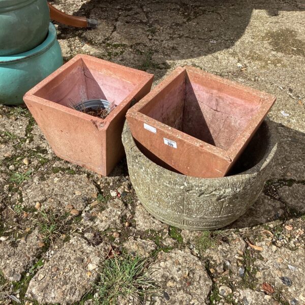 Lot of three weathered terracotta garden planters for outdoor use.