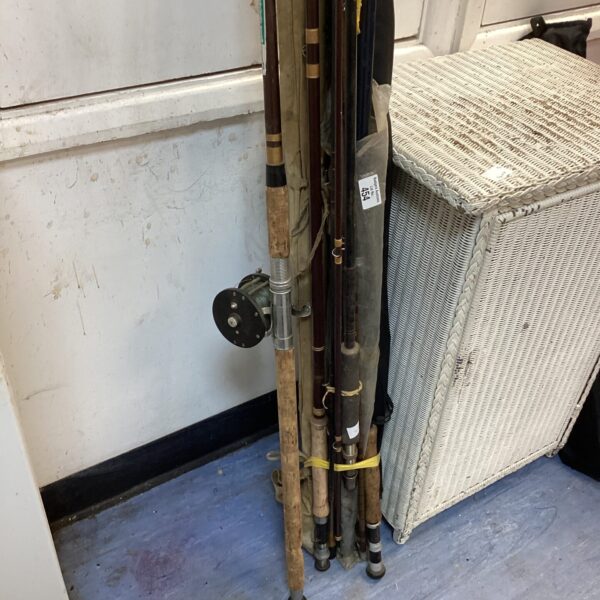 Vintage fishing rods and reel in a lot for collectors.