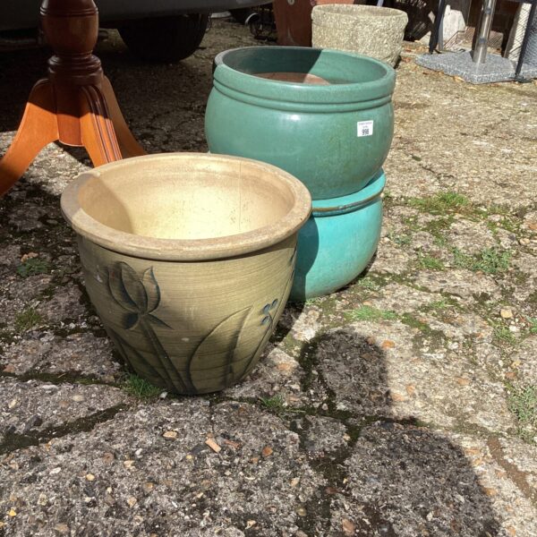 Vintage ceramic garden planters with floral embossed detailing.