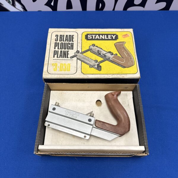 Vintage Stanley 3 blade plough plane for woodworking projects.