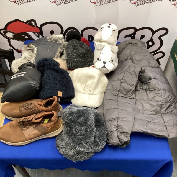 Mixed clothing and footwear lot including hats, jackets, and trainers.