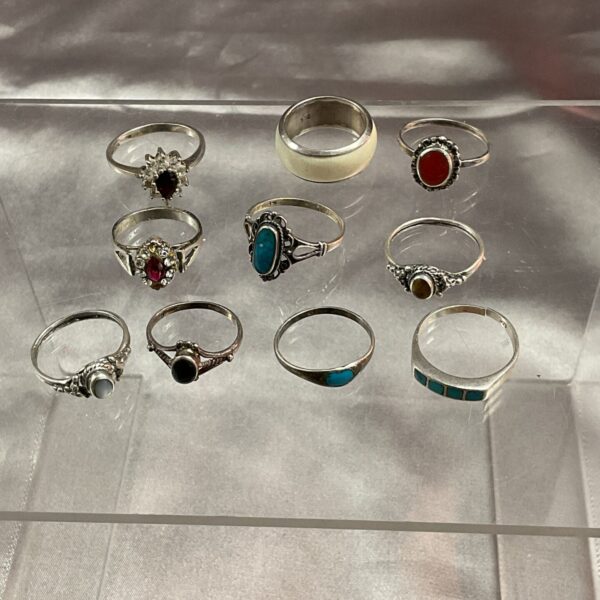 Mixed lot of ten 925 silver stone set rings.