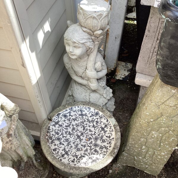 Vintage cherub garden bird bath statue with floral details.