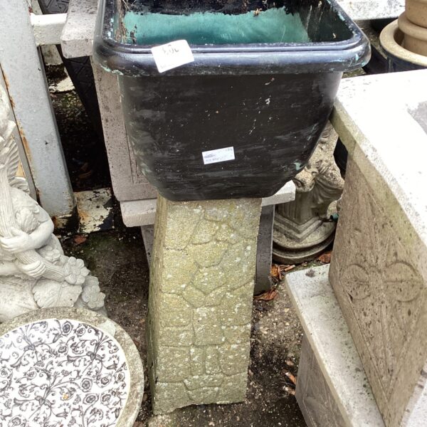 Weathered terracotta garden planter, ideal for outdoor plants and garden decor.