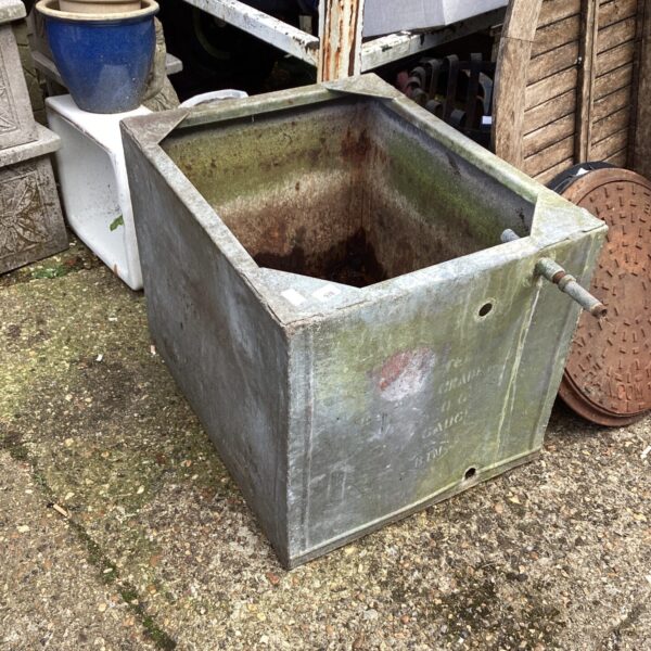 Vintage galvanised water tank, showing signs of age and wear.