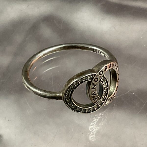 Pandora silver ring size N with detailed openwork design.