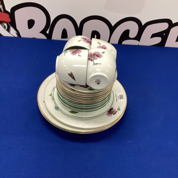 Vintage Royal Worcester tea set with floral patterns on porcelain.