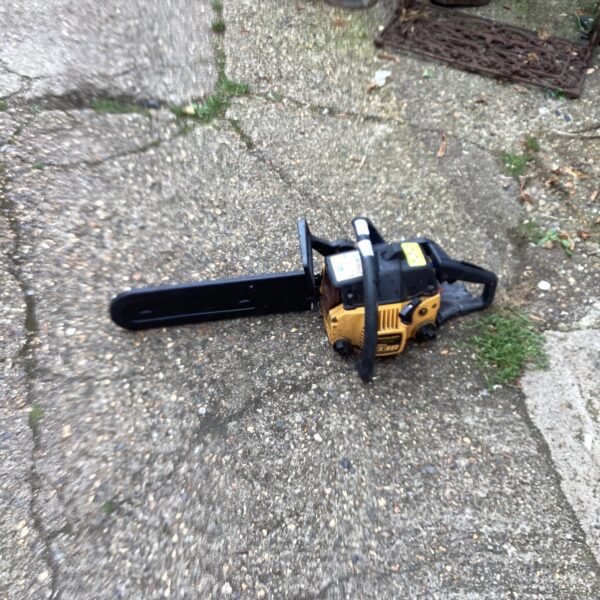 Vintage McCulloch petrol chainsaw in used condition.