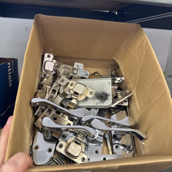 Vintage door hardware lot with locks and hinges.