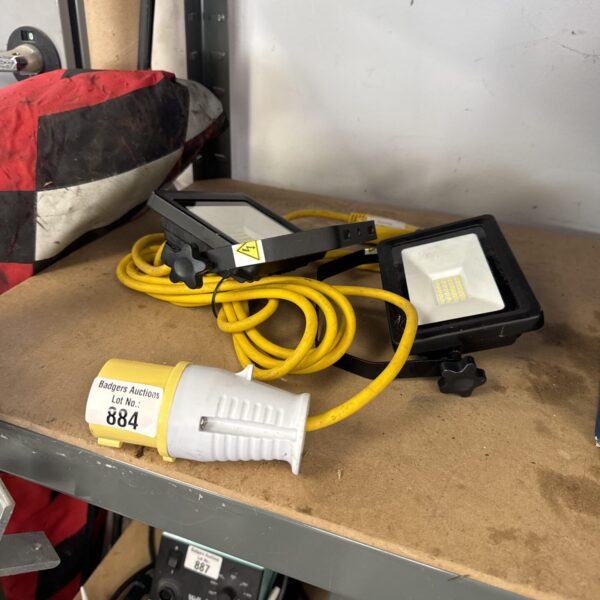Pair of 110v LED work lights with long cables.
