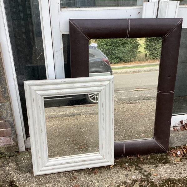 Vintage leather framed mirror for home decor.