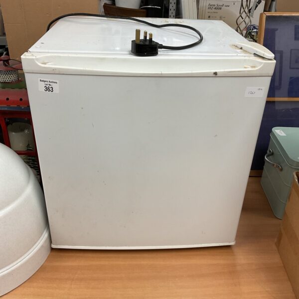 White compact minifridge for small spaces, ideal for dorms.