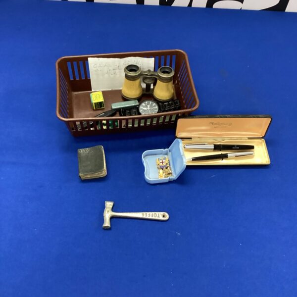 Vintage collectible lot with antique watches and ephemera.