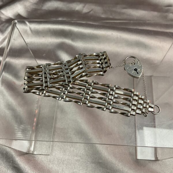 Vintage silver gate bracelet with padlock clasp, elegant jewellery.