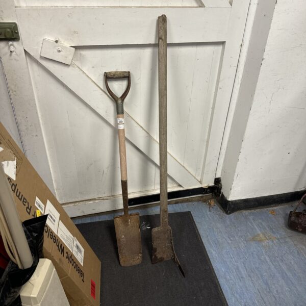Vintage turf cutter spade with wooden handle and pointed blade.