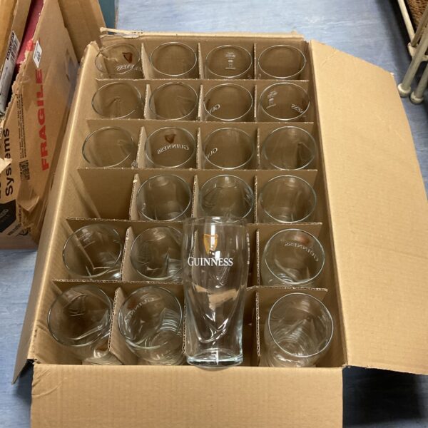 Boxed set of Guinness branded pint glasses for collectors.