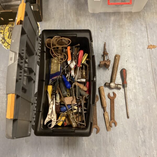 Black toolbox filled with assorted hand tools for DIY projects.