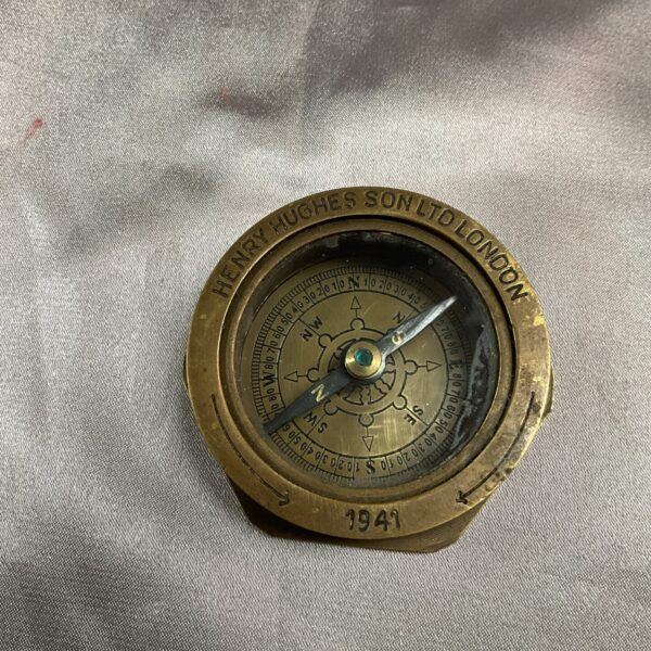 Vintage Henry Hughes brass compass from 1941, front view.