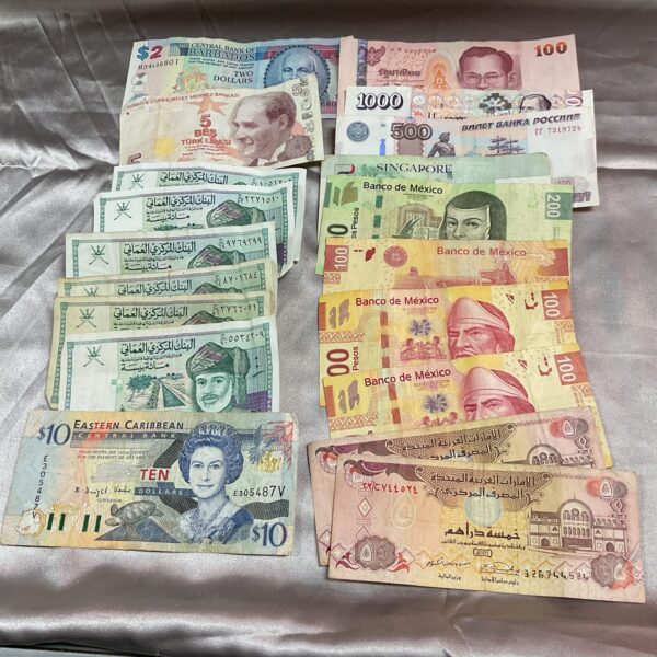Assorted foreign banknotes including Mexican and Barbados currency.
