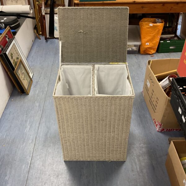 Rectangular wicker laundry basket with a hinged lid.