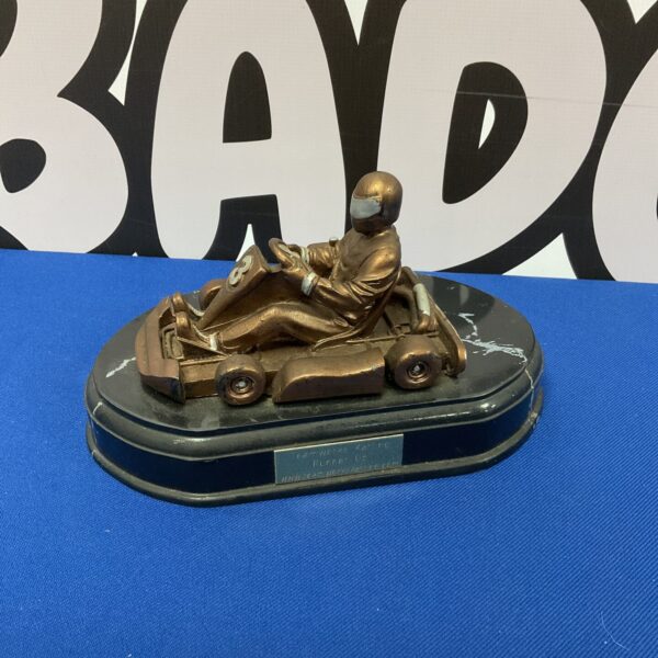 Teamworks karting trophy depicting a racer in action.