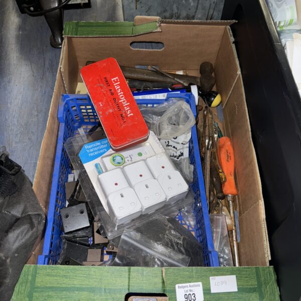 Remote control plugs and transmitter in a shed clearance lot.