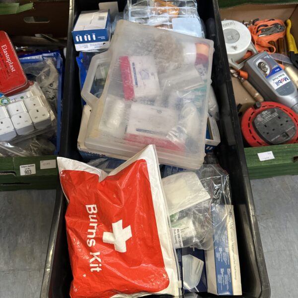 Large lot of assorted first aid supplies and bandages for emergency use.