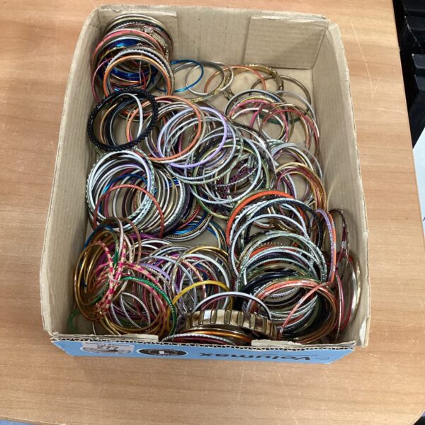 Assorted bangle lot with various designs and finishes.