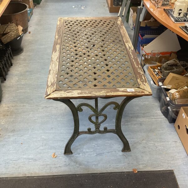 Antique Victorian cast iron garden table with pierced design.