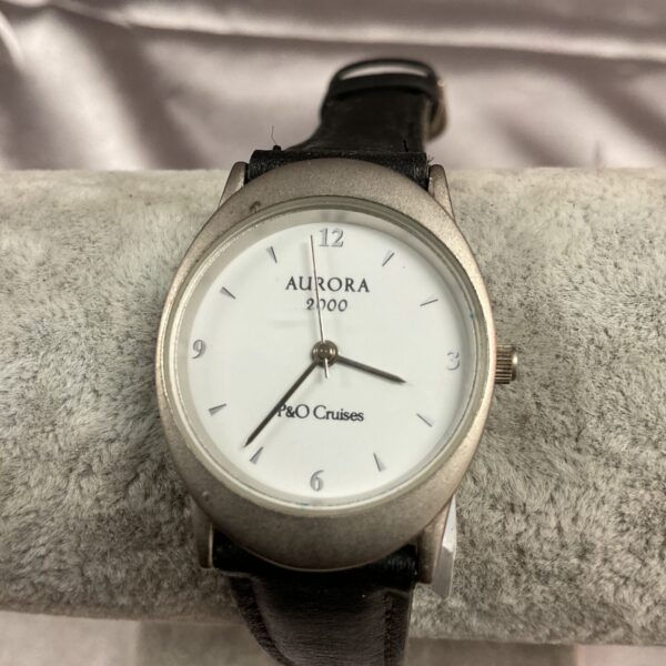 Silver P&O Cruises Aurora quartz wristwatch with leather strap.