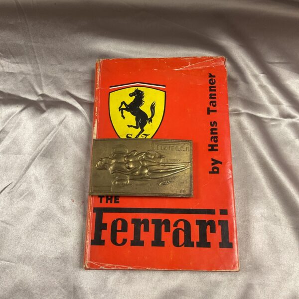 Vintage Ferrari book cover, showcasing the iconic brand.