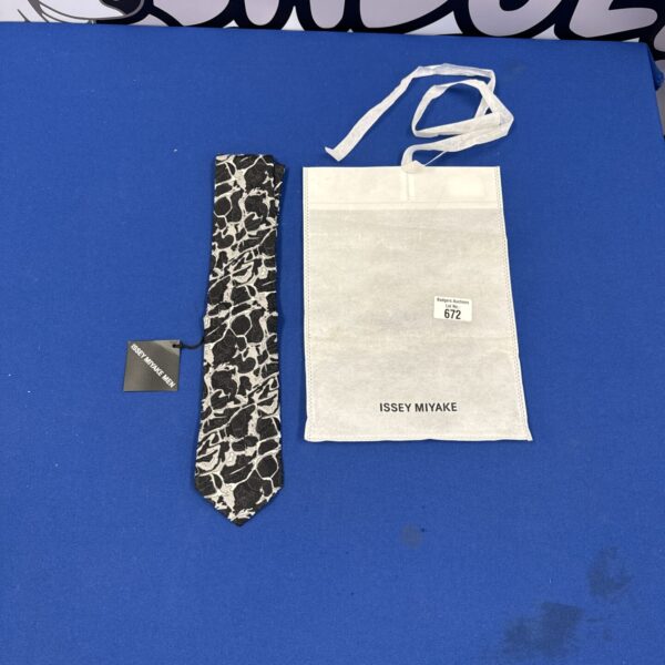Issey Miyake silk tie with a bold grey and black pattern.