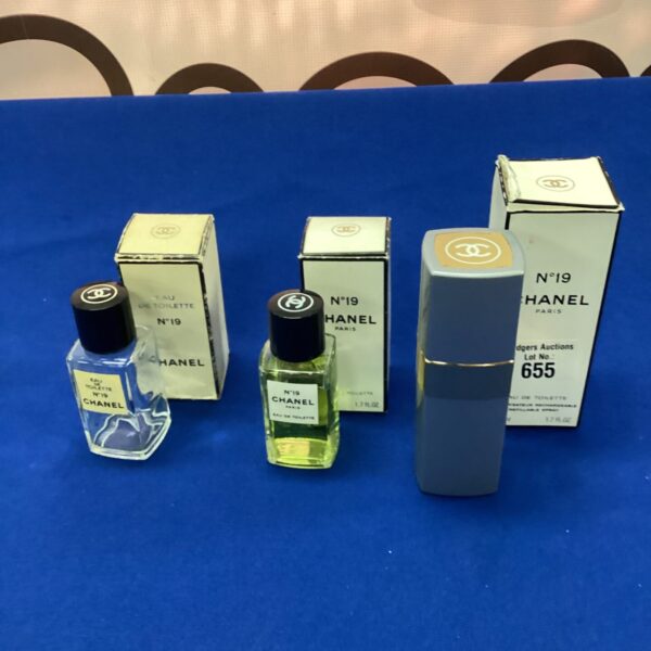 Vintage Chanel No 19 refill bottle with atomizer and empty bottle.