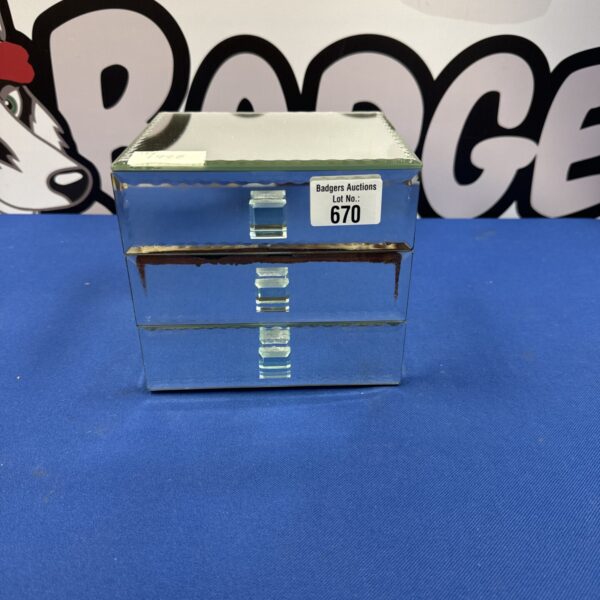 Mirrored jewellery box containing a costume jewellery lot.