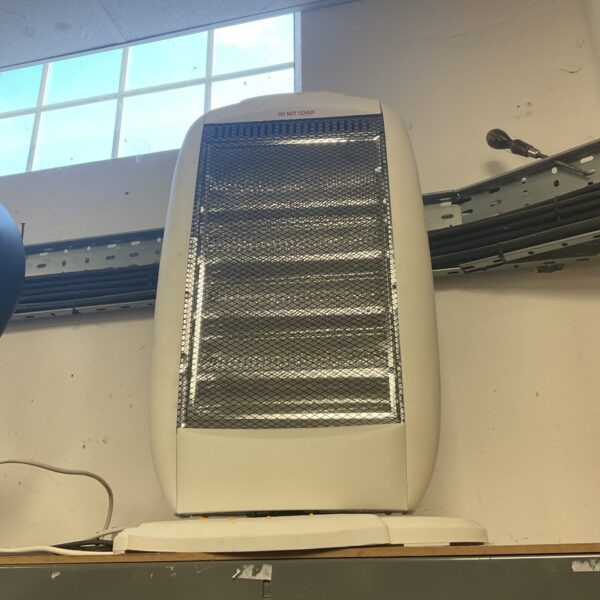 Vintage Challenge halogen heater in white plastic housing.