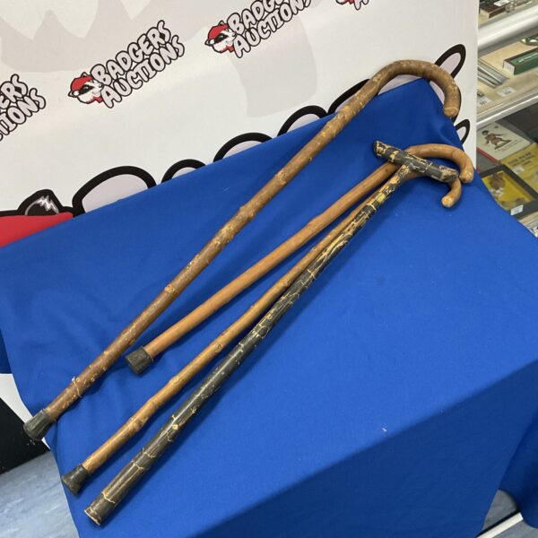 Lot of four vintage wooden walking sticks.