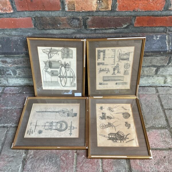 Set of four vintage framed prints of farm machinery.