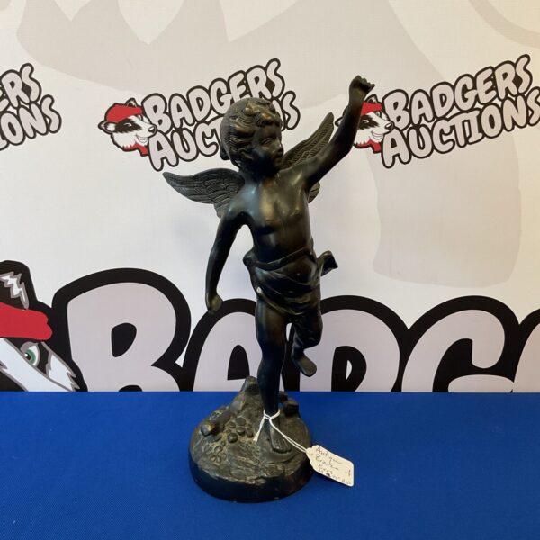 Antique bronze sculpture of Eros, detailed and collectible.