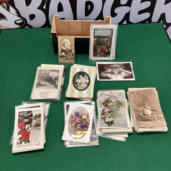 Overview of a vintage postcard lot with various antique cards.