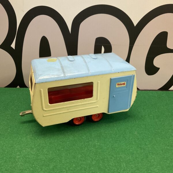 Colourful vintage Triang tin plate caravan, collectible toy.