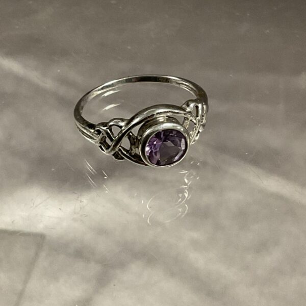 Silver Celtic style amethyst ring, size P.