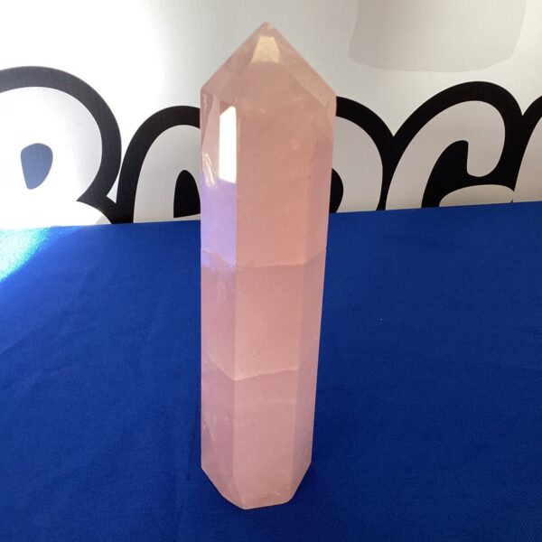 Polished rose quartz tower, a beautiful healing crystal for home decor.
