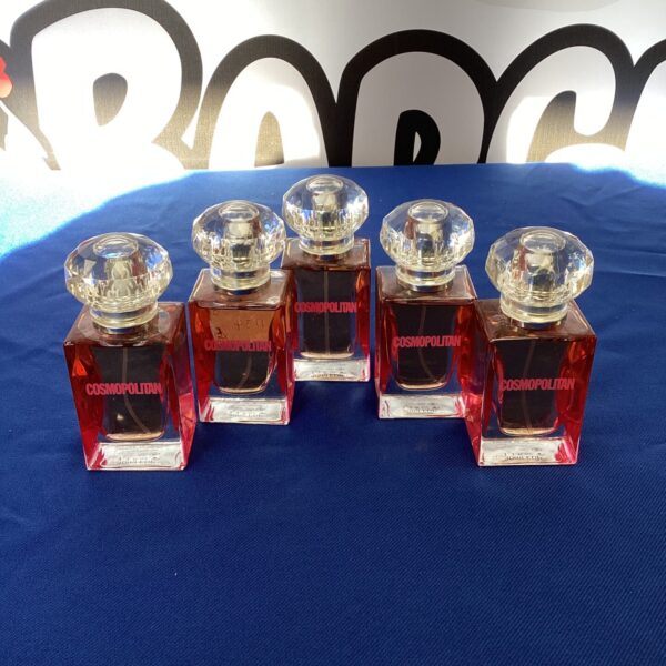 Lot of five vintage Cosmopolitan perfume bottles.
