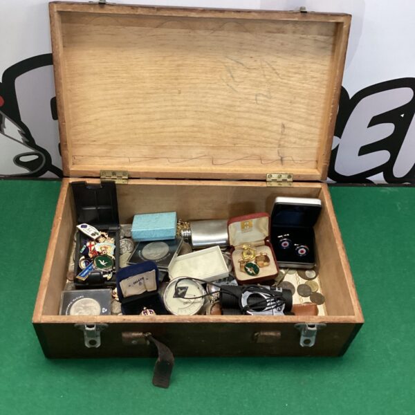 Wooden box filled with vintage and modern mixed lot collectibles.